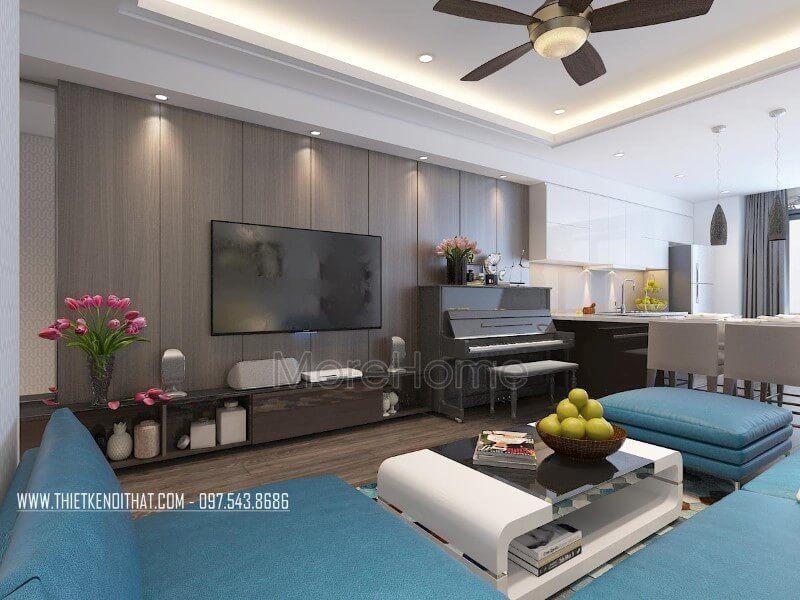 Phòng khách chung cư được trang trí ấn tượng bởi kệ ti vi gỗ công nghiệp.